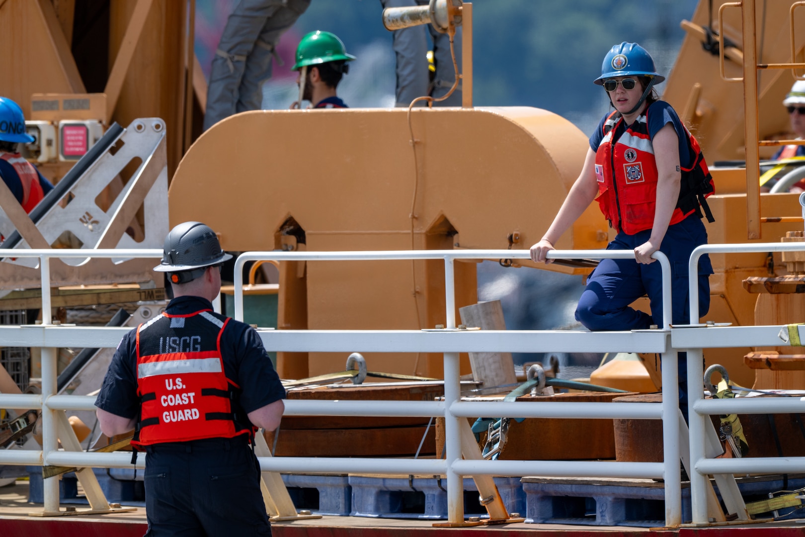 U.S. Coast Guard Cutter Healy (WAGB 20) crewmembers conduct mooring operations to depart from Base Seattle, June 19, 2025. The Healy will conduct high latitude science and research missions in the Arctic. (U.S. Coast Guard photo by Petty Officer 2nd Class Briana Carter)
