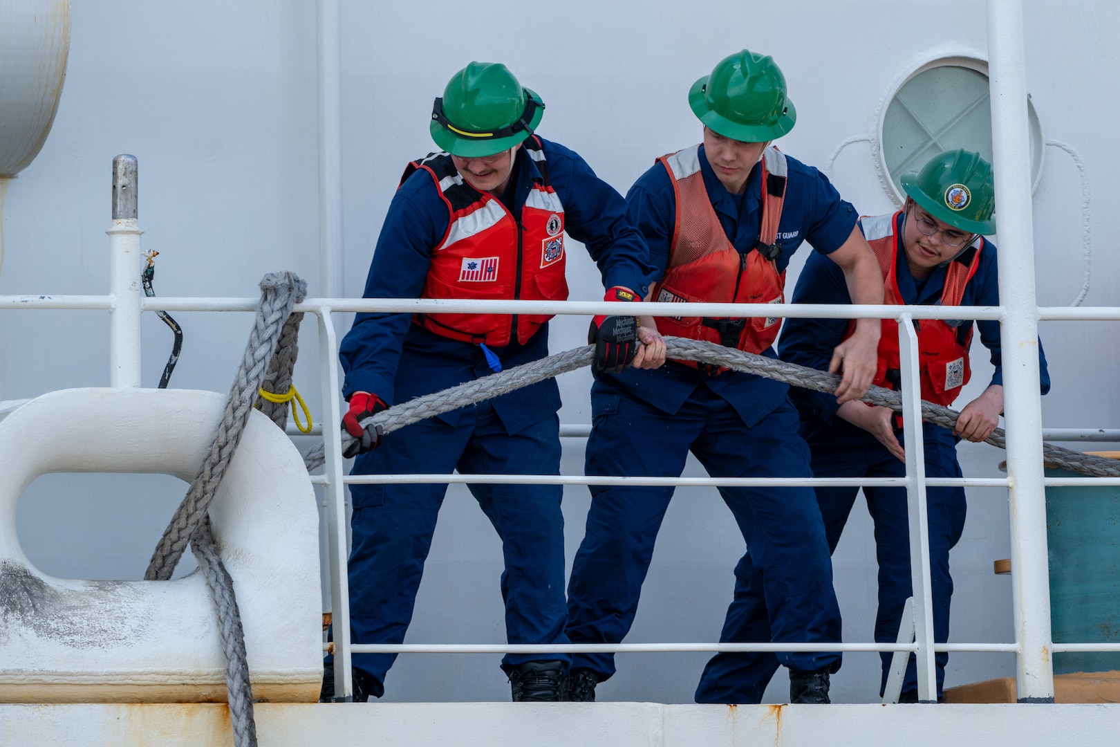 U.S. Coast Guard Cutter Healy (WAGB 20) crewmembers conduct mooring operations to depart from Base Seattle, June 19, 2025. The Healy will conduct high latitude science and research missions in the Arctic. (U.S. Coast Guard photo by Petty Officer 2nd Class Briana Carter)