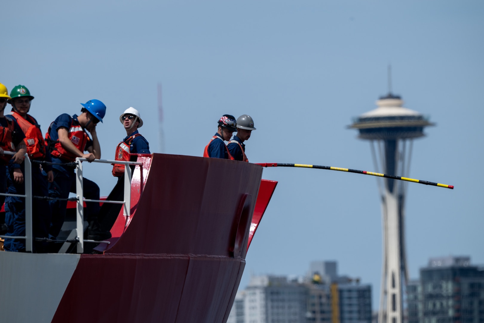 U.S. Coast Guard Cutter Healy (WAGB 20) crewmembers conduct mooring operations to depart from Base Seattle, June 19, 2025. The Healy will conduct high latitude science and research missions in the Arctic. (U.S. Coast Guard photo by Petty Officer 2nd Class Briana Carter)