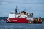 U.S. Coast Guard Cutter Healy (WAGB 20) transits the Puget Sound en route to the Arctic region, June 19, 2025. The Healy will conduct high latitude science and research missions in the Arctic. (U.S. Coast Guard photo by Petty Officer 2nd Class Briana Carter)