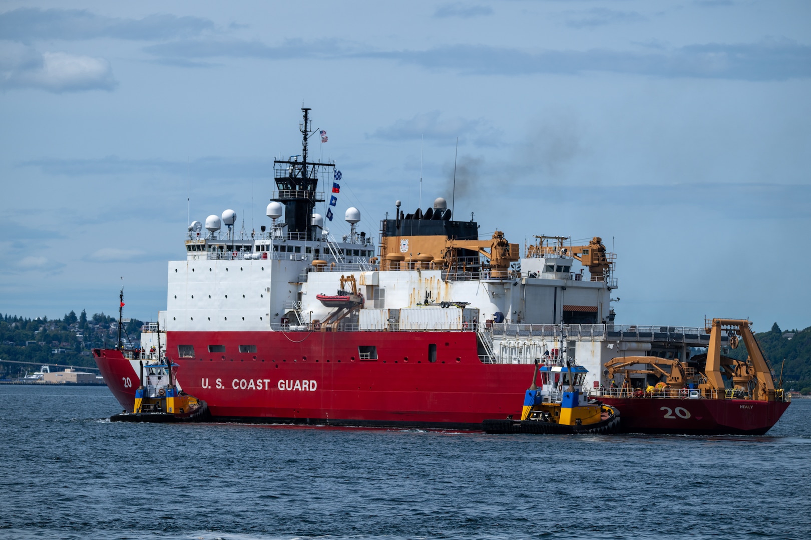 U.S. Coast Guard Cutter Healy (WAGB 20) transits the Puget Sound en route to the Arctic region, June 19, 2025. The Healy will conduct high latitude science and research missions in the Arctic. (U.S. Coast Guard photo by Petty Officer 2nd Class Briana Carter)