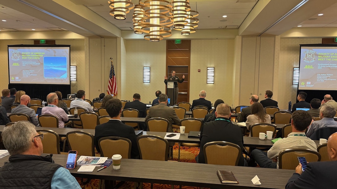 Col. Kathryn Sanborn, commander of the U.S. Army Corps of Engineers, Seattle District, delivers a mission briefing at Society of American Military Engineers (SAME) Northwest Posts Meet the Chiefs 2025 Regional Event on June 17, at the Seattle Airport Marriott, emphasizing the critical role of small businesses in delivering infrastructure solutions across the Pacific Northwest. SAME provides a professional platform for collaboration, technical exchange, and problem-solving—helping the Seattle District stay ahead of emerging threats and engineering demands through shared best practices and innovations.