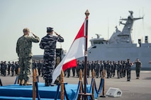 SURABAYA, Indonesia (June 23, 2025) - U.S. Navy Capt. Matt Scarlett, commodore, Destroyer Squadron (DESRON) 7, left, and Rear Adm. I Gung Putu Alit Jaya, commander in chief, 2nd Fleet, Indonesian Navy, participate in the opening ceremony of Cooperation Afloat Readiness and Training (CARAT) Indonesia 2025 at Tentara Nasional Indonesia Angkatan Laut (TNI-AL) headquarters in Surabaya, June 23. CARAT Indonesia is a bilateral exercise between Indonesia and the United States designed to promote regional security cooperation, maintain and strengthen maritime partnerships, and enhance U.S. and partner navies’ abilities to operate together in response to maritime security challenges in the Indo-Pacific region (U.S. Navy photo by Mass Communication Specialist 1st Class Robert Stamer)