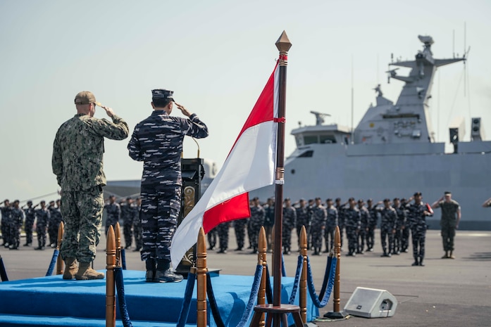 SURABAYA, Indonesia (June 23, 2025) - U.S. Navy Capt. Matt Scarlett, commodore, Destroyer Squadron (DESRON) 7, left, and Rear Adm. I Gung Putu Alit Jaya, commander in chief, 2nd Fleet, Indonesian Navy, participate in the opening ceremony of Cooperation Afloat Readiness and Training (CARAT) Indonesia 2025 at Tentara Nasional Indonesia Angkatan Laut (TNI-AL) headquarters in Surabaya, June 23. CARAT Indonesia is a bilateral exercise between Indonesia and the United States designed to promote regional security cooperation, maintain and strengthen maritime partnerships, and enhance U.S. and partner navies’ abilities to operate together in response to maritime security challenges in the Indo-Pacific region (U.S. Navy photo by Mass Communication Specialist 1st Class Robert Stamer)