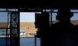 U.S. Army Capt. Kali Rose, the company commander of Headquarters and Headquarters company, 125th Finance Battalion, 8th Military Police Brigade, 8th Theater Sustainment Command, conducts admin work in the combined tactical operations center, while U.S. Soldiers, and Mongolian Armed Forces soldiers conduct medical training on June 20, 2025, at Five Hills Training Area, Mongolia.
