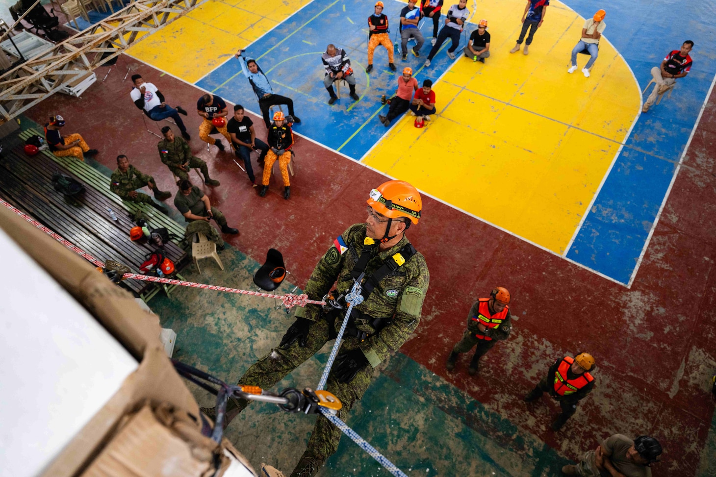 VIRAC, Philippines (June 5, 2025) – Hawaii National Guardsmen and personnel from the Armed Forces of the Philippines instruct local emergency responders and civilian authorities on how to perform a controlled descent in Virac, Philippines, June 5, 2025. This effort is part of a two-week urban rescue training exercise supporting the humanitarian assistance and disaster response objectives of Pacific Partnership 2025. Now in its 21st iteration, Pacific Partnership series is the largest annual multinational humanitarian assistance and disaster management preparedness mission conducted in the Indo-Pacific. Pacific Partnership works collaboratively with host and partner nations to enhance regional interoperability and disaster response capabilities, increase security and stability in the region, and foster new and enduring friendships in the Indo-Pacific. (U.S. Navy photo by Mass Communication Specialist 2nd Class Jordan Jennings)