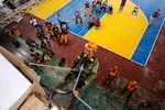 VIRAC, Philippines (June 5, 2025) – Hawaii National Guardsmen and personnel from the Armed Forces of the Philippines instruct local emergency responders and civilian authorities on how to perform a controlled descent in Virac, Philippines, June 5, 2025. This effort is part of a two-week urban rescue training exercise supporting the humanitarian assistance and disaster response objectives of Pacific Partnership 2025. Now in its 21st iteration, Pacific Partnership series is the largest annual multinational humanitarian assistance and disaster management preparedness mission conducted in the Indo-Pacific. Pacific Partnership works collaboratively with host and partner nations to enhance regional interoperability and disaster response capabilities, increase security and stability in the region, and foster new and enduring friendships in the Indo-Pacific. (U.S. Navy photo by Mass Communication Specialist 2nd Class Jordan Jennings)