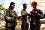 Virac, Philippines (June 3, 2025) – Hawaii National Guard Spc. Elvis Salinas and personnel from the Armed Forces of the Philippines Disaster Response Unit instruct local emergency responders and civilian authorities on knot-tying techniques used in rappelling during a training session in Virac, Philippines, June 3, 2025. This effort is part of a two-week urban rescue training exercise supporting the humanitarian assistance and disaster response objectives of Pacific Partnership 2025. Now in its 21st iteration, Pacific Partnership series is the largest annual multinational humanitarian assistance and disaster management preparedness mission conducted in the Indo-Pacific. Pacific Partnership works collaboratively with host and partner nations to enhance regional interoperability and disaster response capabilities, increase security and stability in the region, and foster new and enduring friendships in the Indo-Pacific. (U.S. Navy photo by Mass Communication Specialist 2nd Class Jordan Jennings)