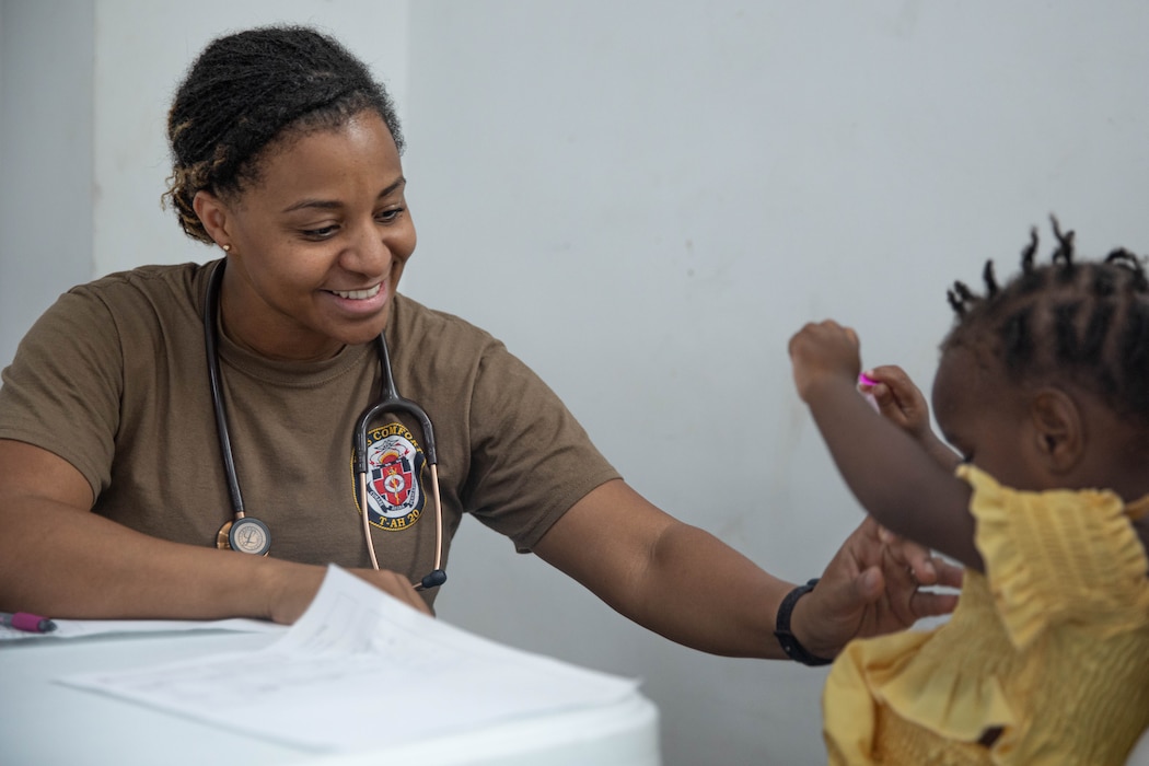 250612-A-DT406-1020 ST. GEORGE’S, Grenada (June 12, 2025) U.S. Navy Cmdr. Sierra Howell, a pediatrician assigned to the Mercy-class hospital ship USNS Comfort (T-AH 20), conducts a medical screening on a Grenadian child during Continuing Promise 2025 in St. George’s, Grenada, June 12, 2025. Continuing Promise 2025 is the 16th iteration of the U.S. 4th Fleet/U.S. Naval Forces Southern Command-led mission since 2007, which aims to foster goodwill, strengthen existing partnerships with partner nations, and form new partnerships between host nations, non-federal entities, and international organizations. (U.S. Army photo by Pfc. Jordan Bristol)