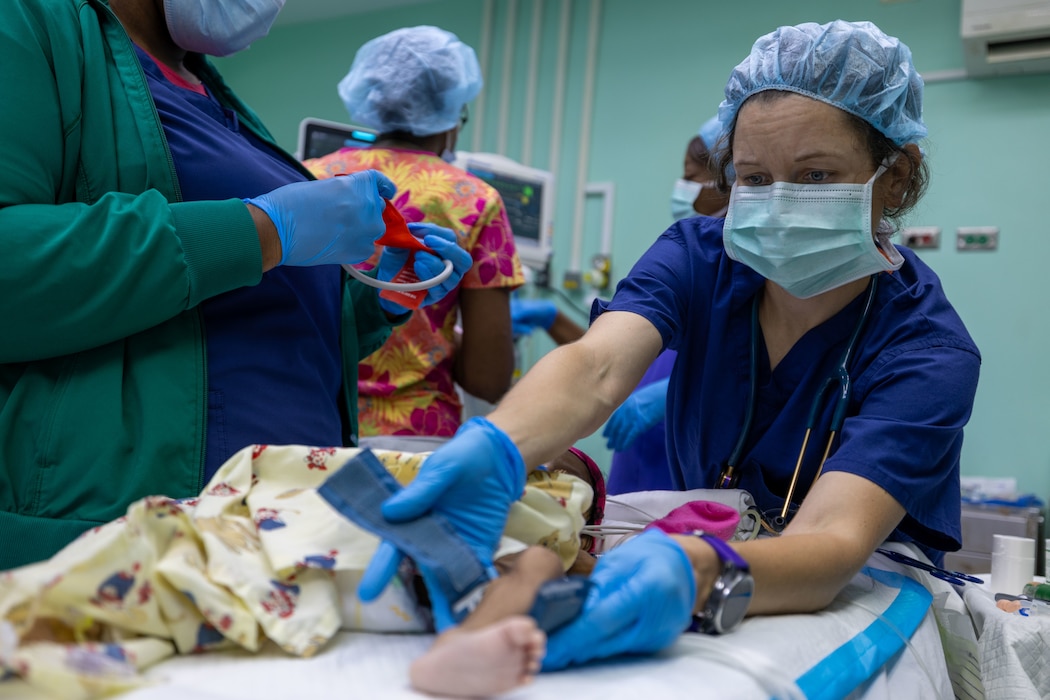 250611-N-MQ781-1184  ST. GEORGE’S, Grenada (June 11, 2025) Cmdr. Jessica Santucci, a pediatric anesthesiologist assigned to the Mercy-class hospital ship USNS Comfort (T-AH 20), places vital monitors on a pediatric patient at Grenada General Hospital during Continuing Promise 2025 in St. George’s, Grenada, June 11, 2025. Continuing Promise 2025 is the 16th iteration of the U.S. 4th Fleet/U.S. Naval Forces Southern Command-led mission since 2007, which aims to foster goodwill, strengthen existing partnerships with partner nations, and form new partnerships between host nations, non-federal entities, and international organizations. (U.S. Navy photo by Mass Communication Specialist 2nd Class Alfredo Marron)