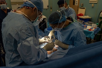 ST. GEORGE’S, Grenada (June 12, 2025) U.S. Navy surgeons, assigned to the Mercy-class hospital ship USNS Comfort (T-AH 20), perform a hernia surgery on a Grenadian citizen aboard Comfort during Continuing Promise 2025 in St. George’s, Grenada, June 12, 2025. Continuing Promise 2025 is the 16th iteration of the U.S. 4th Fleet/U.S. Naval Forces Southern Command-led mission since 2007, which aims to foster goodwill, strengthen existing partnerships with partner nations, and form new partnerships between host nations, non-federal entities, and international organizations. (U.S. Navy photo by Mass Communication Specialist 2nd Class Jonas Womack)