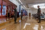 U.S. Marine Corps Sgt. Maj. Joshua K. Miller, left, outgoing sergeant major of II Marine Information Group, II Marine Expeditionary Force, Sgt. Maj. Shelby S. Smith, middle, oncoming sergeant major, and Col. Ian Fletcher, commanding officer, stand at attention, at Marine Corps Base Camp Lejeune, North Carolina, June 25, 2025. A relief and appointment ceremony is a military tradition that signifies all responsibilities and authorities being transferred between the old and new senior enlisted leader of the command. (U.S. Marine Corps photo by Lance Cpl. Daniel R. Garcia)