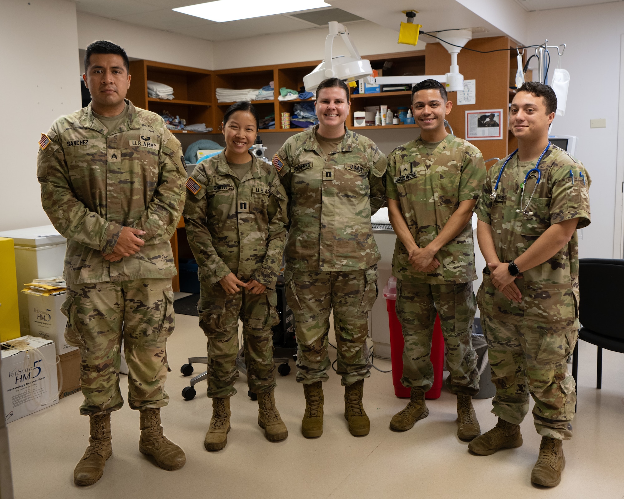 U.S. Army veterinary team assigned to the Veterinary Readiness Activity, Patrick Space Force Base, Florida, pose for a group photo after a routine dental procedure on a Air Force 6th Security Forces Squadron military working dog at MacDill Air Force Base, Florida, June 3, 2025. The joint procedure brought together two service branches to ensure 6th SFS military working dogs remain fit to fight. (U.S. Air Force photo by Airman 1st Class Helen Ly)