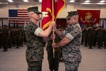 U.S. Marine Corps Col. Erik C. C. Quist, the incoming commanding officer of the Chemical Biological Incident Response Force, receives the unit colors from Col. Zeb B. Beasley, the outgoing commanding officer, during a change of command ceremony at Naval Facility Indian Head, Indian Head, Maryland, June 24, 2025. The ceremony represents the transfer of authority, responsibility, and accountability from the outgoing to the incoming battalion commander. (U.S. Marine Corps photo by Lance Cpl. Angel G. Ponce)