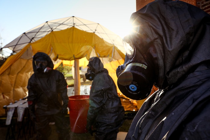 U.S. Marines with the Chemical Biological Incident Response Force decontaminate a simulated casualty during a training exercise at Naval Air Station Patuxent River, Maryland, on Apr. 8, 2025. The Marines participated in a battalion-wide exercise across Virginia and Maryland, simulating multiple coordinated attacks. The high-risk training scenarios focused on reconnaissance, decontamination, and casualty rescue were designed to sharpen lifesaving skills and enhance overall unit readiness. (U.S. Marine Corps Photo by Lance Cpl. Angel G. Ponce)
