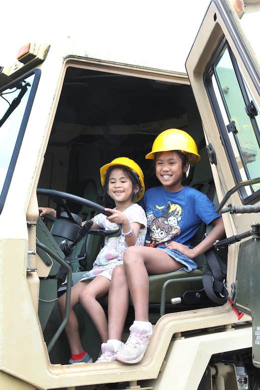 Event participants pause for a photo during the annual Rolling Meadows Touch a Truck event, June 20, 2025.