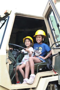 Event participants pause for a photo during the annual Rolling Meadows Touch a Truck event, June 20, 2025.