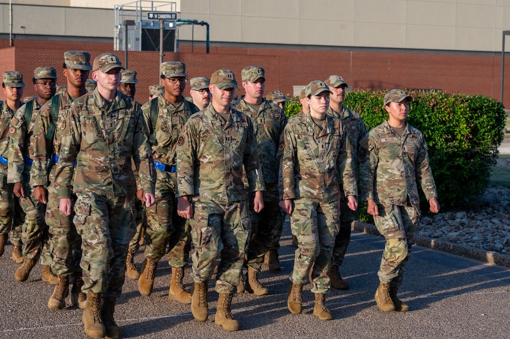 Members of the 315th Training Squadron march towards their campus as part of a mock deployment and bag-drag exercise held at Goodfellow Air Force Base, Texas, June 25th. During the event, officers led their enlisted wingmen through a mock-deployment sequence, consisting of a march across their campus and a detailed inspection. (U.S. Air Force photo by Airman 1st Class James Salellas)