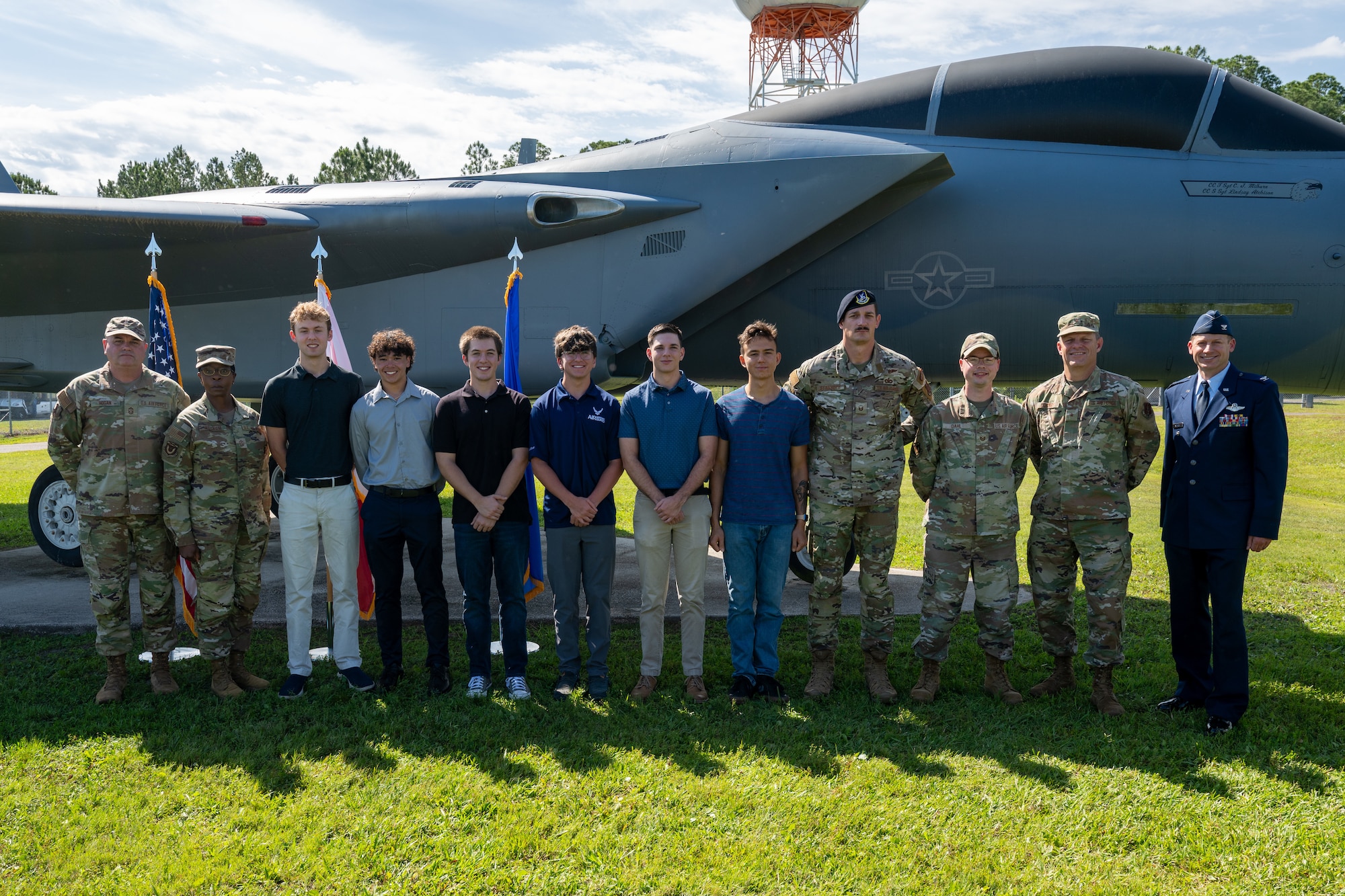 Newly enlisted Airmen pose with recruiters and senior leaders from the 125th Fighter Wing and Florida Air National Guard.
