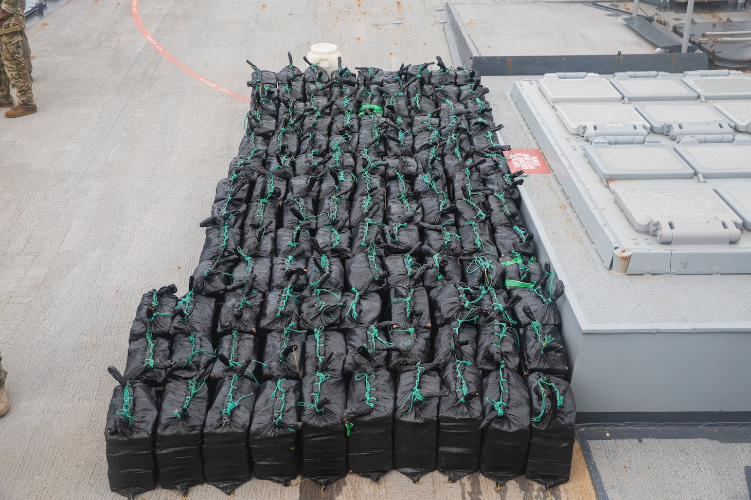 PACIFIC OCEAN - Members of a U.S. Coast Guard Law Enforcement Detachment and U.S. Navy Sailors assigned to the Arleigh Burke-class guided-missile destroyer USS Sampson (DDG 102) seized approximately 7,850 pounds of contraband during a visit, board, search and seizure operation, June 22, 2025. Sampson is employed under U.S. Northern Command's maritime homeland defense authorities with a Coast Guard Law Enforcement Detachment embarked to enable maritime interdiction missions to prevent the flow of illegal drugs and other illegal activity. U.S. Northern Command is working together with the Department of Homeland Security to provide additional military forces and capabilities at the southern border. (Official U.S. Navy photo).