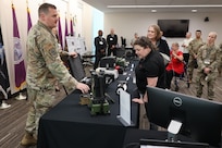 U.S. Air Force MSgt Timothy Lyons, Joint CBRN Program Manager, demonstrates radiological and nuclear defense capabilities for participants during Aberdeen Proving Ground’s “Behind the Gate” tour in celebration of the U.S. Army’s 250th anniversary.