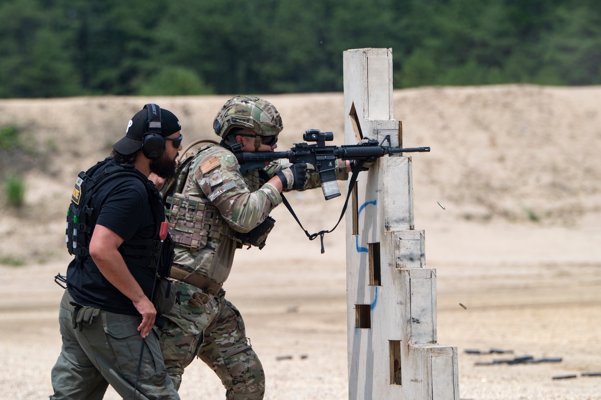 Airmen conduct weapons training outside