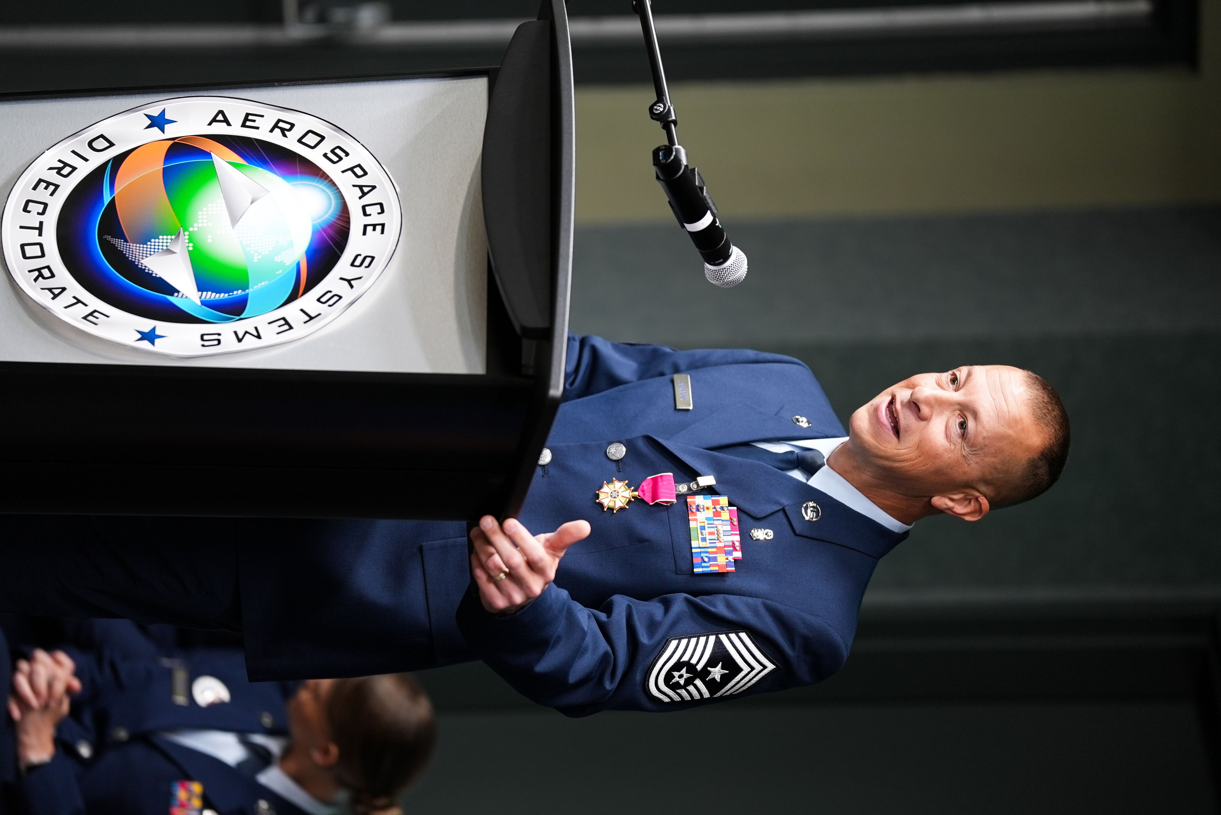 Chief Master Sgt. Carlos Labrador, outgoing command chief of the Air Force Research Laboratory (AFRL), speaks at the AFRL Change of Responsibility Ceremony at Wright-Patterson Air Force Base, Ohio, June 18, 2025.  The incoming command chief is Chief Master Sgt. Timothey Hodgin. (U.S. Air Force photo by Ryan Law)