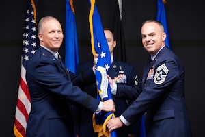 The Air Force Research Laboratory (AFRL) welcomed Chief Master Sgt. Timothey Hodgin as its new command chief during a change of responsibility ceremony at Wright-Patterson Air Force Base, Ohio, June 18, 2025.  The outgoing command chief is Chief Master Sgt. Carlos Labrador, who served as command chief since July 2023. (U.S. Air Force photo by Ryan Law)