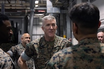 U.S. Marine Corps Maj. Gen. Jason G. Woodworth, Commander, Marine Corps Installations Command Assistant Deputy Commandant, Installations & Logistics (Facilities), speaks with Marines assigned to Chemical Biological Incident Response Force (CBIRF) while on a tour of CBIRF and its facilities on Naval Support Facility Indian Head, Maryland, June 6, 2025. The visit focused on assessing current infrastructure, identifying opportunities to improve facilities and quality of life for Marines, and showcasing CBIRF’s specialized capabilities and future mission support initiatives. (U.S. Marine Corps photo by Lance Cpl. Amy Espinoza)