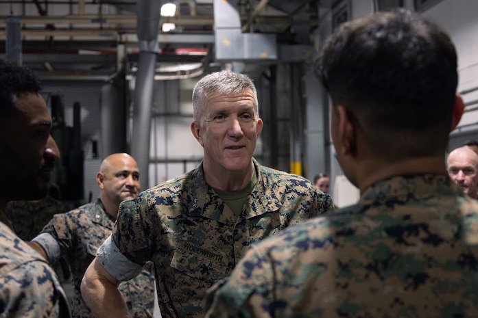 U.S. Marine Corps Maj. Gen. Jason G. Woodworth, Commander, Marine Corps Installations Command Assistant Deputy Commandant, Installations & Logistics (Facilities), speaks with Marines assigned to Chemical Biological Incident Response Force (CBIRF) while on a tour of CBIRF and its facilities on Naval Support Facility Indian Head, Maryland, June 6, 2025. The visit focused on assessing current infrastructure, identifying opportunities to improve facilities and quality of life for Marines, and showcasing CBIRF’s specialized capabilities and future mission support initiatives. (U.S. Marine Corps photo by Lance Cpl. Amy Espinoza)
