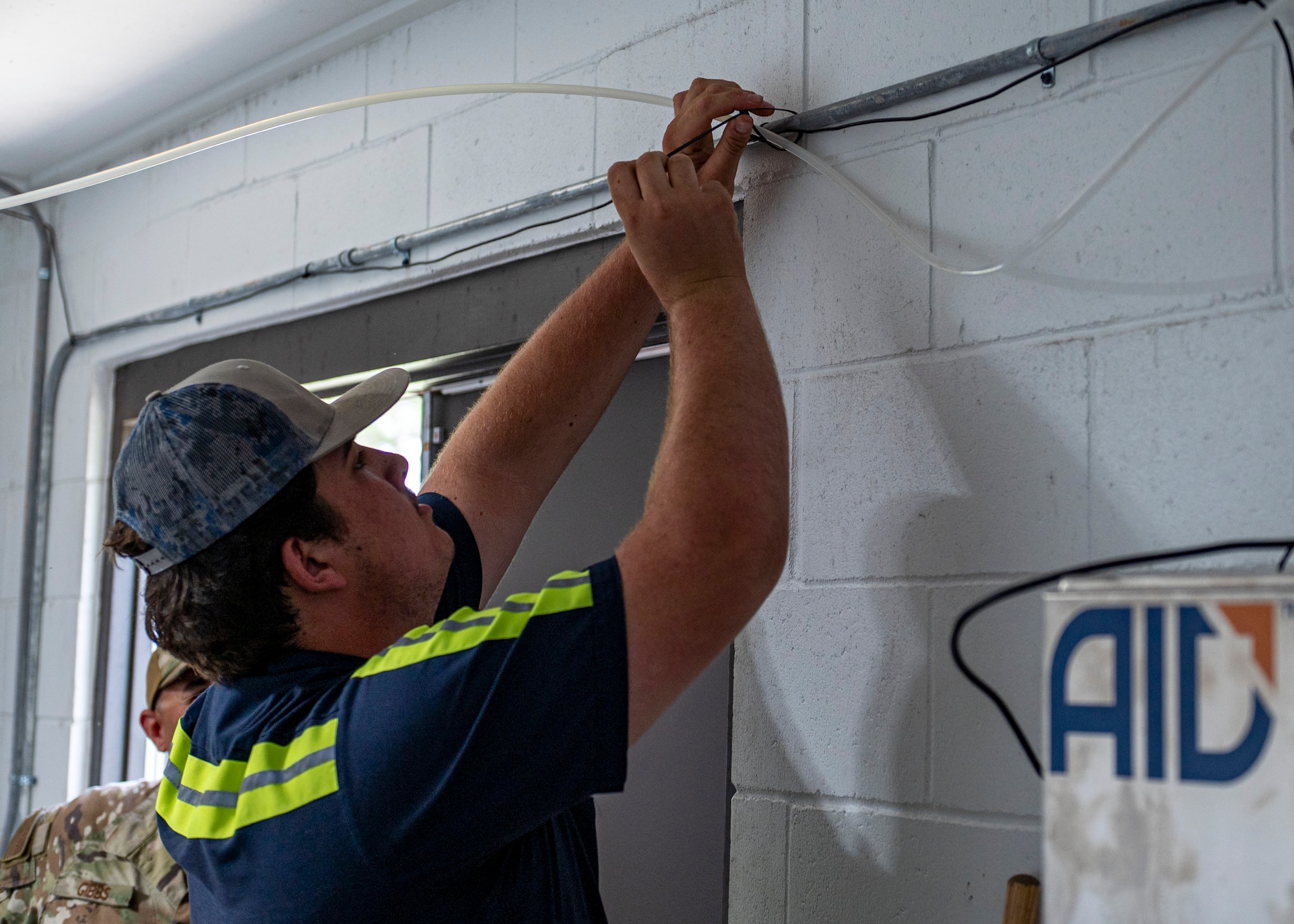 A Lowndes County water specialist runs a hose at Moody Air Force Base, Georgia, May 28, 2025. This step was part of joint efforts to adjust chlorine levels, monitor water quality and ensure it met health and safety standards. (U.S. Air Force photo by Senior Airman Leonid Soubbotine)