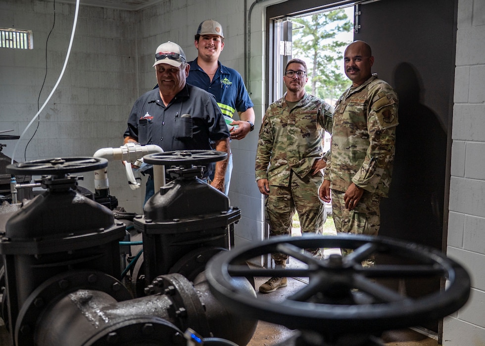 U.S Air Force Airmen assigned to the 23rd Civil Engineer Squadron and Lowndes County water specialists stand in the water intake building at Moody Air Force Base, Georgia, May 28, 2025. The joint team assessed water flow systems and sampling points as part of a coordinated response to recent temporary change in the installation’s water source. (U.S. Air Force photo by Senior Airman Leonid Soubbotine)