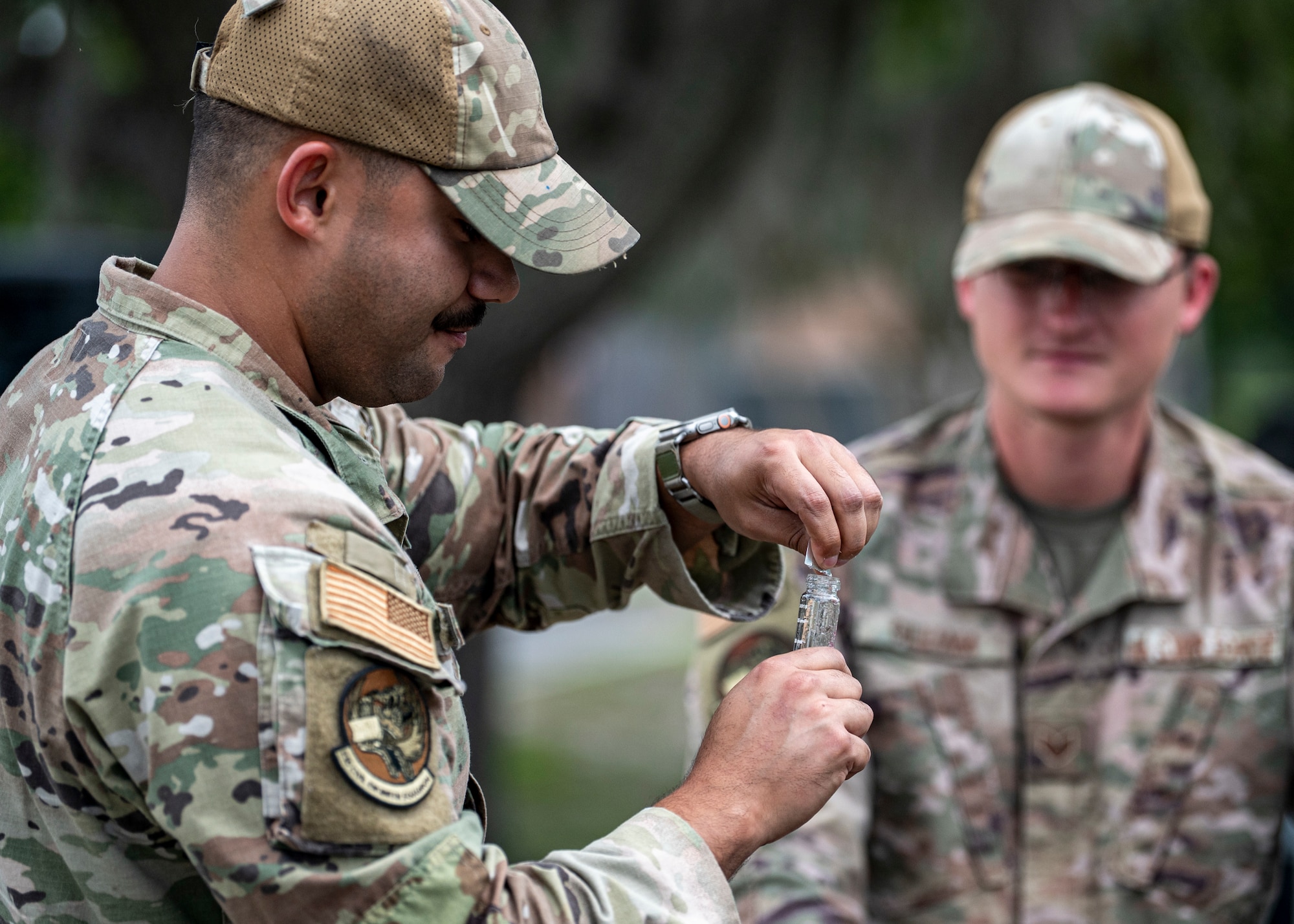 U.S. Air Force Senior Airman Mark Arroyo, 23rd Civil Engineer Squadron water and fuels systems maintenance technician, tests a water sample at Moody Air Force Base, Georgia, May 28, 2025. The CE Airmen played a key role in testing, treating, and maintaining the quality of water across the installation. (U.S. Air Force photo by Senior Airman Leonid Soubbotine)