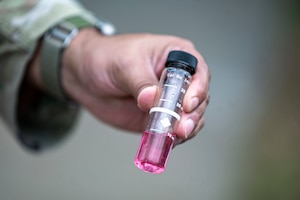 A U.S Air Force Airmen assigned to the 23rd Civil Engineer Squadron holds a water test sample at Moody Air Force Base, Georgia, May 28, 2025. Airmen from water and fuels systems maintenance work behind the scenes to keep Moody’s water supply safe and up to code. (U.S. Air Force photo by Senior Airman Leonid Soubbotine)