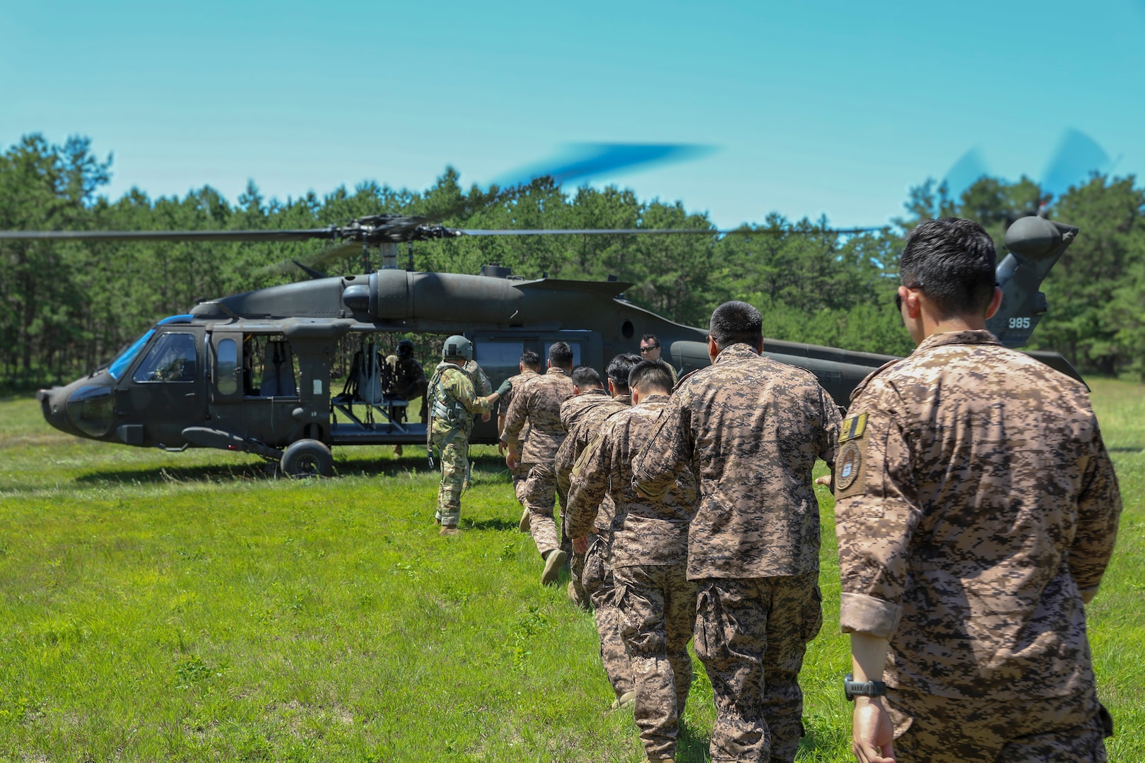 During Exercise Regional Cooperation 25 (RC 25), Mongolian partners board a UH-60 Black Hawk at Camp Edwards, Massachusetts, on June 24, 2025.