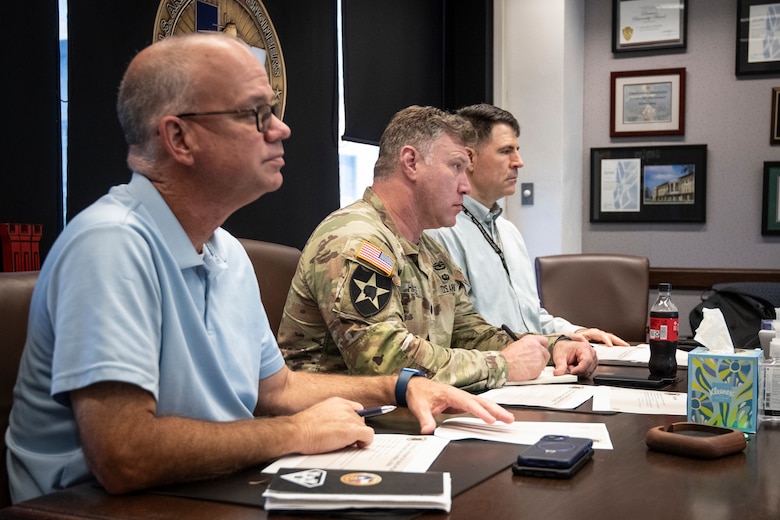 The U.S. Army Corps of Engineers' Fort Worth District's senior leadership, Rob Newman, Lt. Col Joshua Haynes, and Clay Morgan, listen to an inbrief from members of the USACE Inspector General’s office. The IG team is visiting the district to inspect the district’s use of the Program and Project Management Information System, or P2. (US Army photo by Richard Bumgardner, SWF Public Affairs)