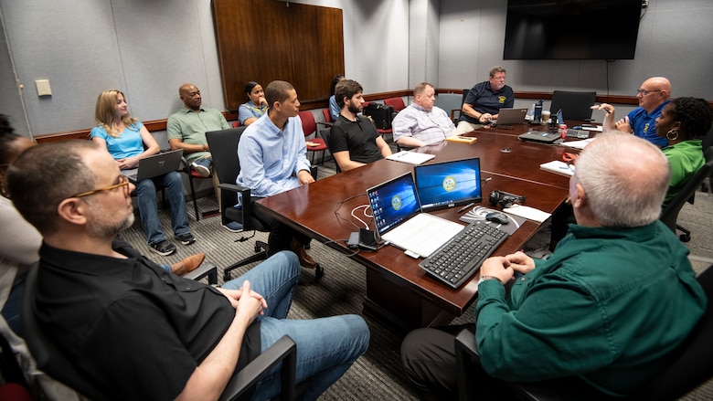 Project schedulers from the U.S. Army Corps of Engineers' Fort Worth District, listen to Greg Cissell, the USACE Inspector General team lead, during an evaluation of the district’s use of the Program and Project Management Information System, or P2. (US Army photo by Richard Bumgardner, SWF Public Affairs)