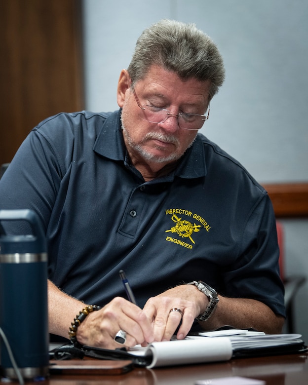 The U.S. Army Corps of Engineers' Fort Worth District welcomed a three-member team from the USACE Inspector General’s office for an inspection of the district’s use of the Program and Project Management Information System, or P2. Shown here is Kevin Elliott, the Army Corps of Engineers' Inspector General, taking notes during a meeting with district schedulers. (US Army photo by Richard Bumgardner, SWF Public Affairs)