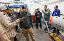 Ammo Product Manager John Swain (l) and Dept. of Defense Explosives Safety Board Jose Rullan-Rodriguez question Electronic Tech Michael Jenkins about the process of receiving missiles and converting them into Airbirds at NWS Yorktown, Virginia, May 22, 2025.