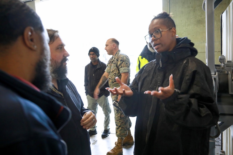 NWS Yorktown work leader Team 2 Latronda Curry, explains how the weapons are marked and stored in the magazine to Ammo Product Manager Melvin Miller and Christian Zwileneff, May 22, 2025.