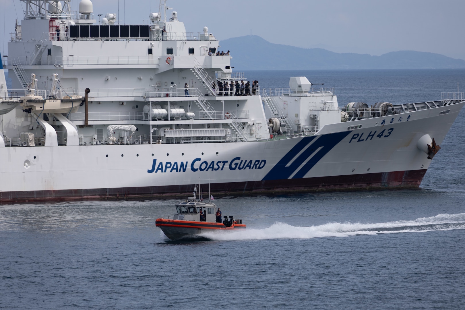 A 35-foot Long Range Interceptor II from the Legend-class U.S. Coast Guard Cutter Stratton (WMSL 752) transits alongside the Japan Coast Guard Patrol Vessel Asanagi (PLH-43) during a trilateral search and rescue exercise with the U.S., Japan and Philippine Coast Guards in Kagoshima, Japan, June 20, 2025. Stratton is deployed and assigned to Destroyer Squadron (DESRON) 15, the Navy’s largest DESRON and the U.S. 7th Fleet’s principal surface force. Stratton is deployed to the Indo-Pacific to advance relationships with ally and partner nations to build a more secure and prosperous region with unrestricted, lawful access to the maritime commons. (U.S. Coast Guard photo courtesy of Stratton)