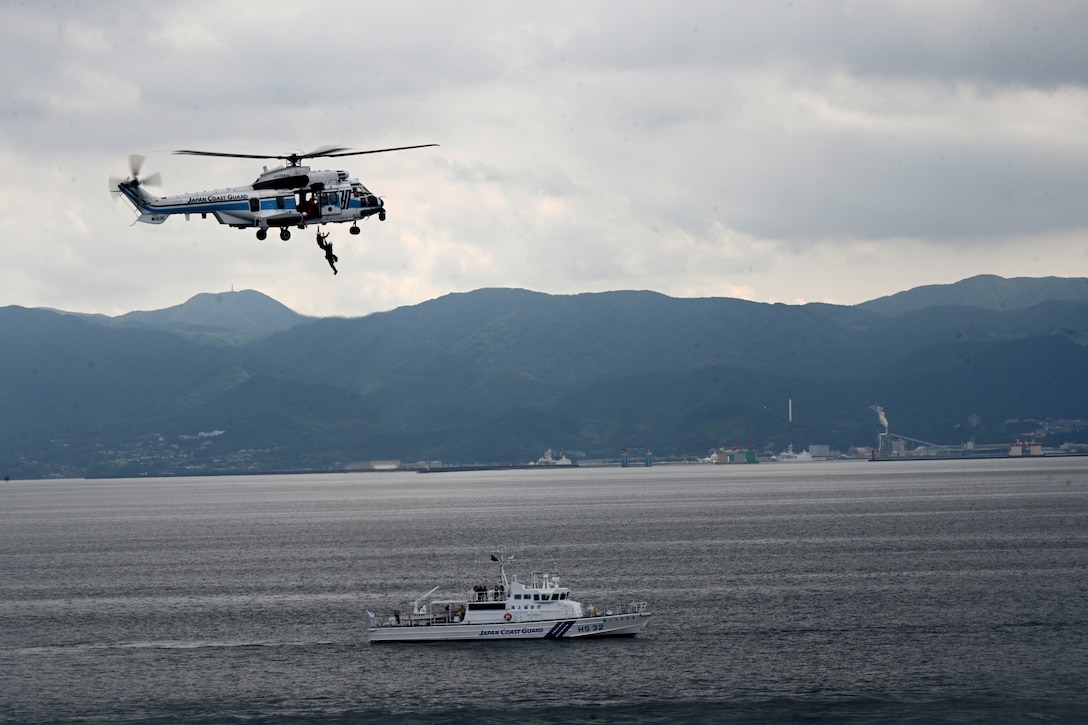 A Japan Coast Guard helicopter lowers a rescue diver during a trilateral search and rescue exercise with the U.S. Coast Guard Cutter Stratton (WMSL 752) and the Philippine Coast Guard vessel BRP Teresa Magbanua (MRRV-9701) in Kagoshima, Japan, June 2025. Stratton is deployed and assigned to Destroyer Squadron (DESRON) 15, the Navy’s largest DESRON and the U.S. 7th Fleet’s principal surface force. Stratton is deployed to the Indo-Pacific to advance relationships with ally and partner nations to build a more secure and prosperous region with unrestricted, lawful access to the maritime commons. (U.S. Coast Guard photo by Senior Chief Petty Officer Matthew S. Masaschi)