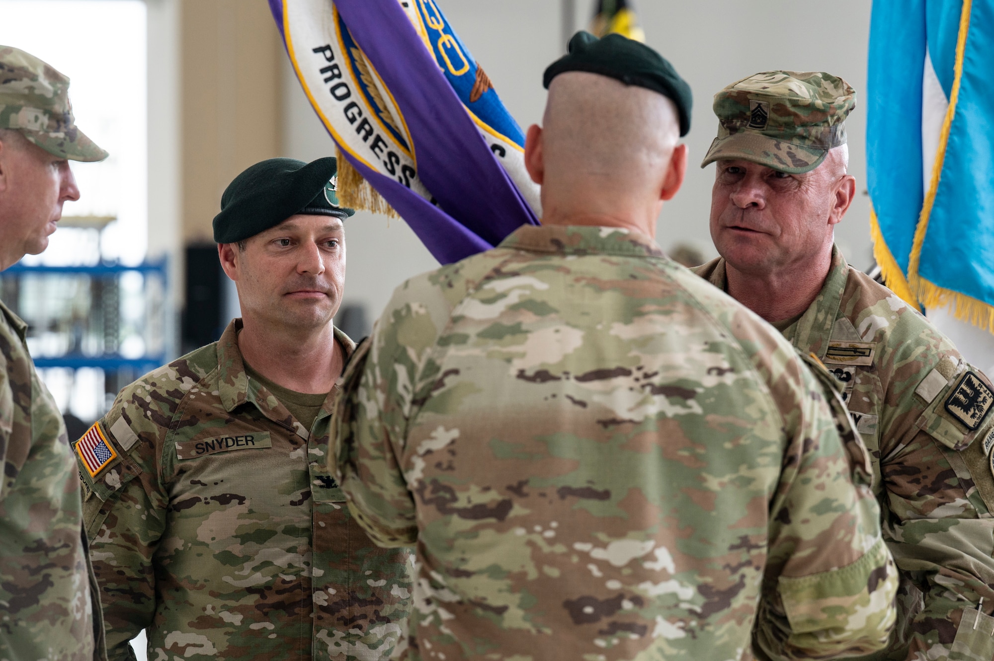 Joint Task Force Bravo change of command photo in which CSM Harris receives the command flag from Col. Alder, outgoing JTF-Bravo commander.