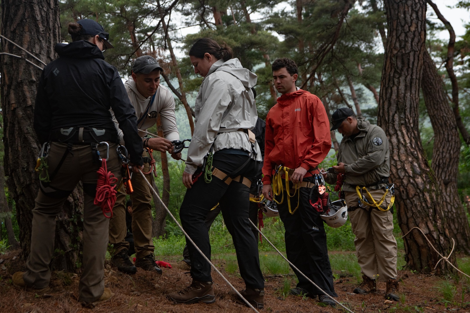 U.S. Army Sgt. Brandon Valverde, a mountaineer with the Defense POW/ MIA Accounting Agency, instructs recovery team members on rappel safety as a part of training for a DPAA recovery mission in South Korea, May 22, 2025.