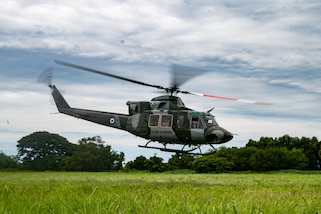 A Salvadoran Bell 412 helicopter takes off en route to the Central Military Hospital with a simulated patient on board during a training exercise in Ilopango, El Salvador, June 20, 2025. Salvadoran ground medical teams worked together to load the patient onto the aircraft as part of the AMISTAD campaign, a mission promoting cooperation between healthcare professionals of the U.S. and partner nations. (U.S. Air Force photo by Tech. Sgt. Justin Norton)