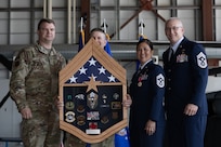 Chief Master Sgt. Kim T. Groat relinquishes the position of the State Command Chief Master Sergeant of the Alaska Air National Guard to Chief Master Sgt. Jeffrey A. Ling during a change of responsibility ceremony at Joint Base Elmendorf-Richardson, Alaska, June 18, 2025. Brig. Gen. Brian D. Kile, the commander of the Alaska Air National Guard, presided over the ceremony.