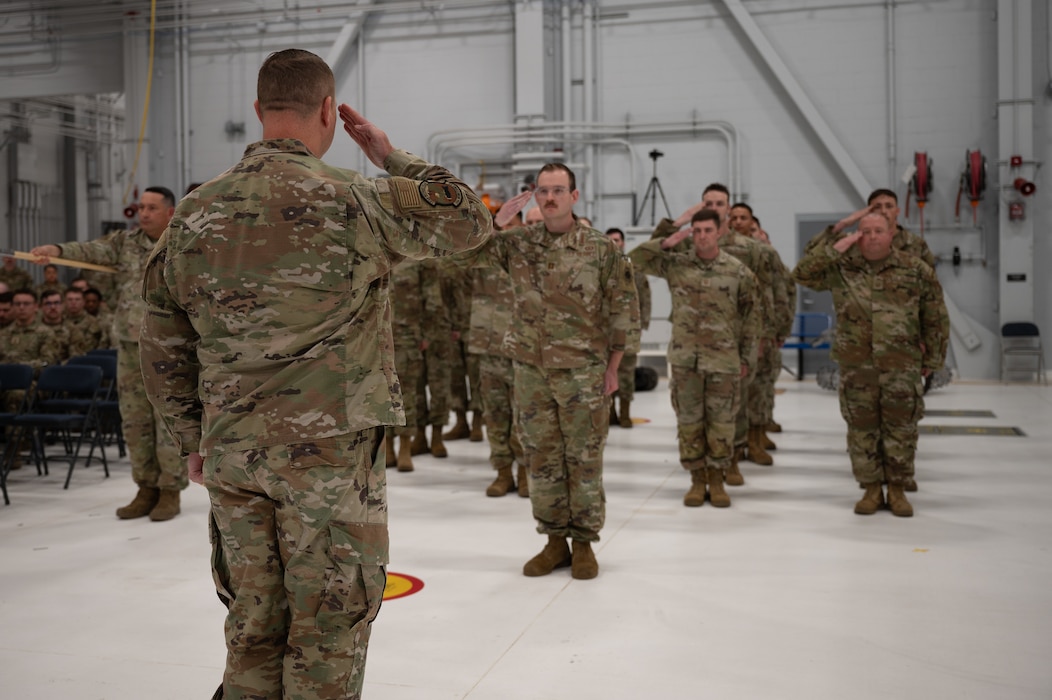 U.S. Air Force Maj. Garrett Evans, 354th Munitions Squadron incoming commander, renders an initial salute to the formation during a change of command ceremony at Eielson Air Force Base, Alaska, June 26, 2025.