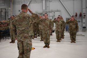 U.S. Air Force Maj. Garrett Evans, 354th Munitions Squadron incoming commander, renders an initial salute to the formation during a change of command ceremony at Eielson Air Force Base, Alaska, June 26, 2025.