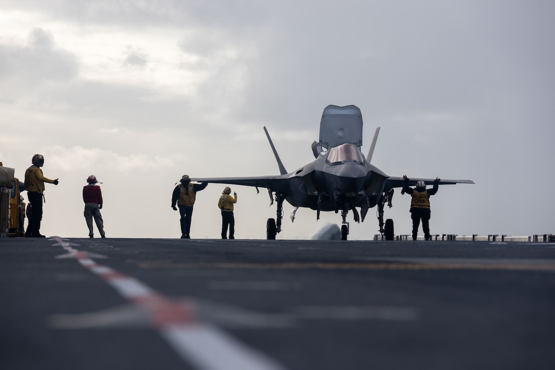 A U.S. Marine Corps F-35B Lightning II aircraft assigned to Marine Fighter Attack Squadron (VMFA) 242, 31st Expeditionary Unit, prepares to take down during flight operations aboard amphibious assault ship USS America (LHA 6), in the Coral Sea, June 22, 2025. Marines with VMFA 242 and Marine Tiltrotor Squadron (VMM) 265 (Rein.) conduct flight operations consisting of F35B Lightning II aircraft, MV-22B Osprey helicopters and CH-53E Super Stallions, demonstrating multi-domain transport and 5th generation multi-discipline strike capabilities to support combined-joint operations in key maritime terrain. The 31st MEU is operating aboard ships of the USS America Amphibious Ready Group in the 7th Fleet area of operations, the U.S. Navy’s largest forward-deployed numbered fleet, and routinely interacts and operates with allies and partners in preserving a free and open Indo-Pacific region. (U.S. Marine Corps photo by Sgt. Peter Rawlins)