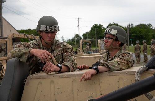 Two Airmen talking.